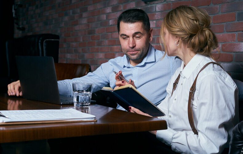 A lady talking to a man