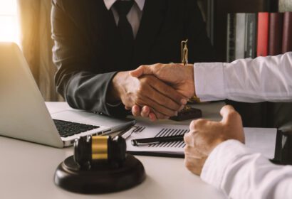 Two people shaking hands with each other